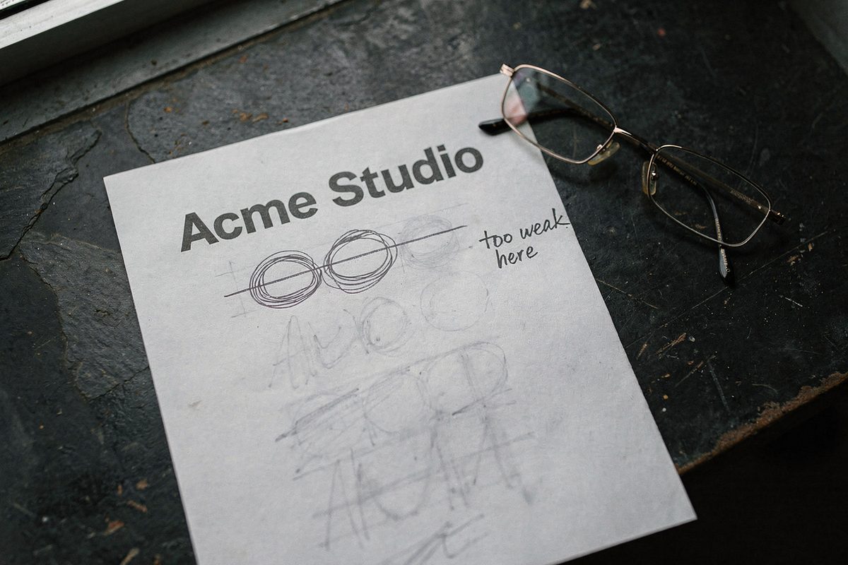 A printed company name marked up by hand during a rename audit.
